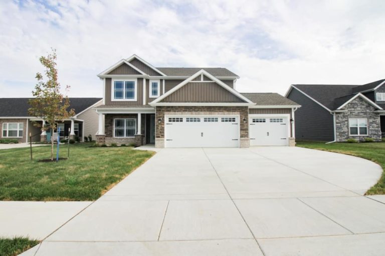 Newly constructed concrete driveway for house garage