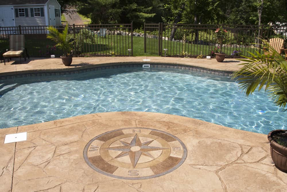 Beautiful Pool side stamped patio overlays installed in a luxury house